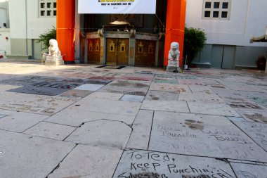 Hollywood, Los Angeles, California - July 22, 2024: TLC Grauman's Chinese Theatre Handprints Footprints and signatures cemented in the forecourt of the theater clipart