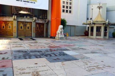 Hollywood, Los Angeles, California - July 22, 2024: TLC Grauman's Chinese Theatre Handprints Footprints and signatures cemented in the forecourt of the theater clipart