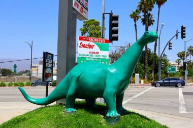 Burbank, California - June 18, 2024: Sinclair Gas Station, DINO the Apatosaurus dinosaur located at 3701 W Riverside Dr clipart