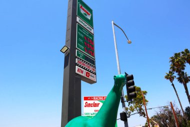 Burbank, California - June 18, 2024: Sinclair Gas Station, DINO the Apatosaurus dinosaur located at 3701 W Riverside Dr clipart