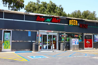 Burbank, California - June 18, 2024: Dino Mart at Sinclair Gas Station, owned by HF Sinclair Corporation clipart