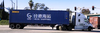 Los Angeles, California - 13 January 2025: Freight Truck carrying an HEDE SHIPPING shipping container on a street toward the Port of Los Angeles in San Pedro clipart