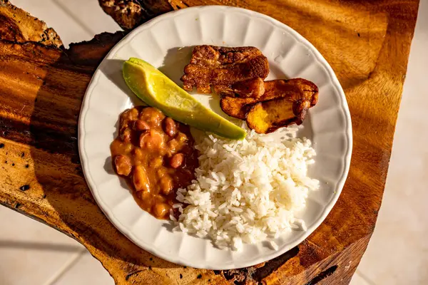 typical brazilian food. rice with meat and fried chicken.