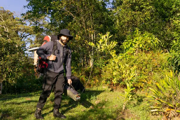 adventurous man camping in Colombian village