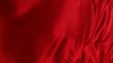 Doku, arka plan. Desen. Kırmızı kumaş. Lüks, yumuşak kumaş bir kumaştır. Lüks, lüks bir kumaş.
