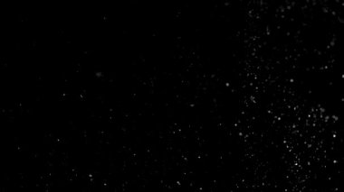 Siyah arkaplanda gümüş bokeh.