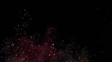 Yavaş çekimde ışıldayan bir patlama Bokeh arka planında parlayan sönmüş ışıltılı toz makrosuyla yakın çekim. Yüzen altın parıltılar. Parlayan Parçacıklar. Üst üste