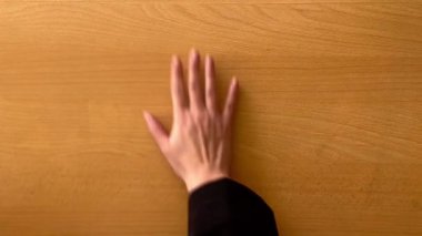 Five colleagues make gesture of partnership, support, cooperation teamwork. Group of businesspeople putting their hands on top of each other in office, team building concept