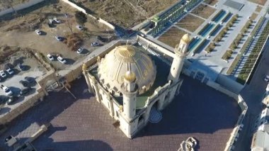 Aerial view of an Islamic mosque with golden domes