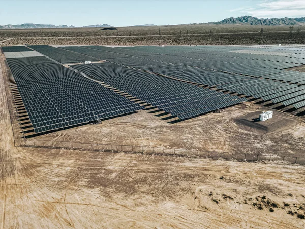 Renewable solar energy solar farm in the desert of southern Nevada on a dry lake bed gathering sun rays and photovoltaic energy to provide sustainable electricity to nearby Las Vegas and other surrounding areas to be more modern, environmental, and i