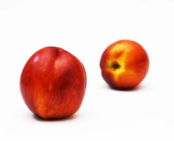 stock image Nectarine fruit isolated on white background. Shallow depth of field