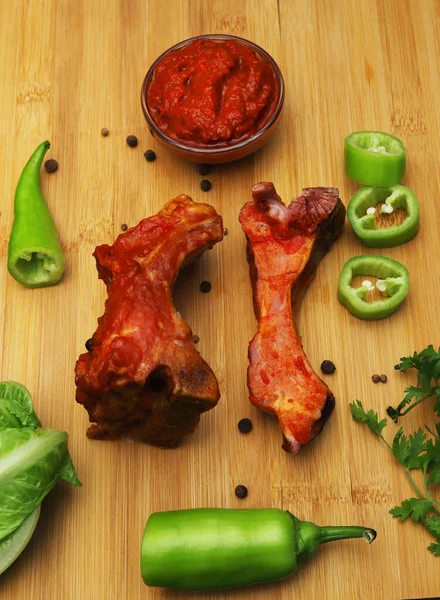 Fried Smoked Pork Ribs Covered Ajika Sauce Fresh Vegetables Cutting — Stock Photo, Image