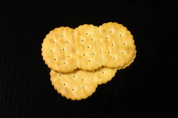 Oval Crackers Black Table Reflection Close — Stock Photo, Image