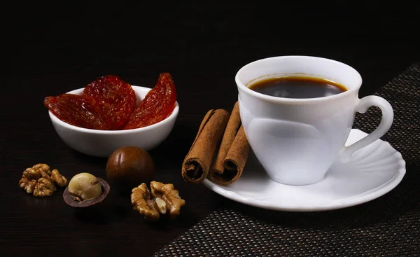 Cup Black Coffee Dark Table Nuts Cinnamon Dried Fruit Shallow — Stock Photo, Image