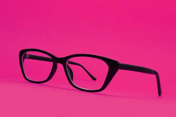 Glazen Met Diopters Een Zwart Frame Een Roze Achtergrond Ondiepe — Stockfoto