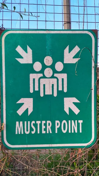 stock image Sign post muster point for people gather together when emergency situation happen, like fire and earthquake.