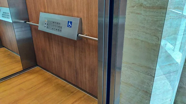 The disabled elevator button or panel with braille code of the elevator.