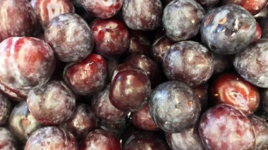 Pile of Syzygium cumini or java plum or black plum display at the market.