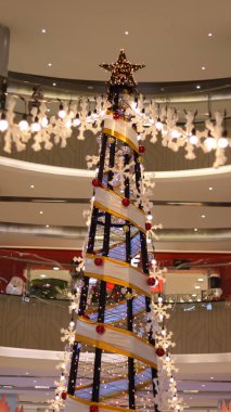 Star top of Christmas tree decoration and light at the mall.