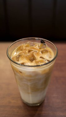 Cafe latte in a high glass or long glass in a table.