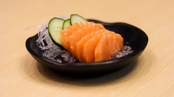 Sliced raw salmon fish or salmon fillet or salmon sashimi as Japanese food restaurant. Asian food Japan sushi restaurant menu.