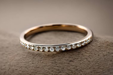 stunning close up shot of a single wedding rings, delicately intertwined to symbolize the everlasting bond of love and commitment. Jewelry gold diamond ring for anniversary, valentine, or engagement