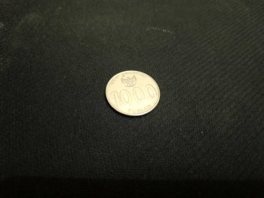 one thousand rupiah Indonesian money coins.