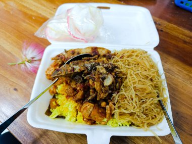 a pack of yellow rice and tempeh with noodles