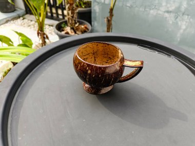 Coconut shell cup on the table