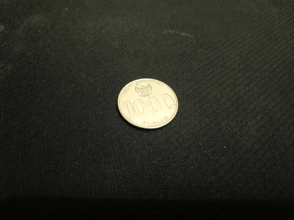 one thousand rupiah Indonesian money coins.