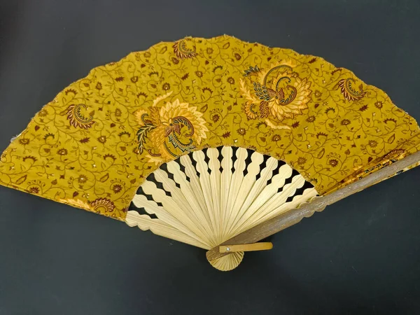 Batik hand fan with wooden handle