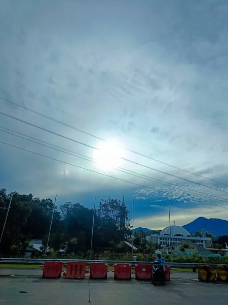 The view of sun and sky from the car in the highway