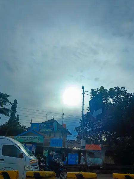 The view of sun and sky from the car in the highway