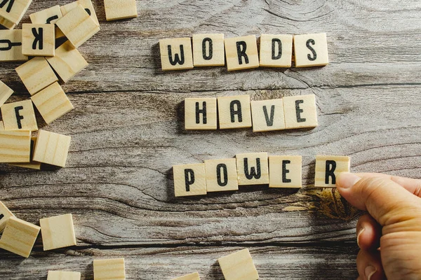 Words Have Power word cube on wood background ,English language learning concept