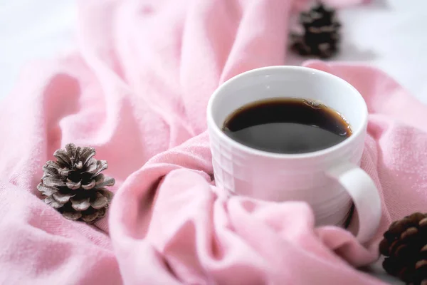 christmas and new year background. coffee and fir-white scarf with pink and red cup of cappuccino and