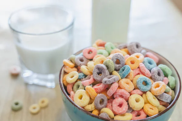 stock image Bowl of colorful children's cereal and milk isolated on wood table with Text space