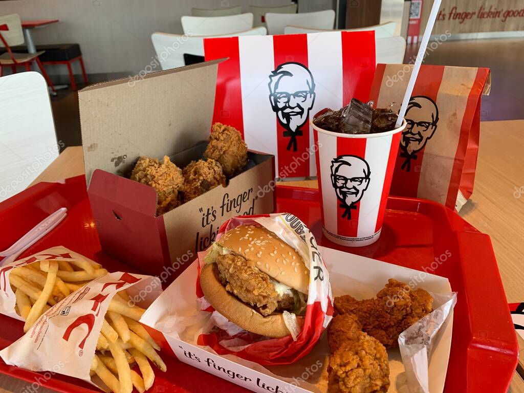 Ayutthaya,Thailand - Apr 06,2022: KFC Hamburger and Fried Chicken set at fast food restaurant Kentucky Fried Chicken (KFC) is a large restaurant chain. At Big C, Wangnoi branch in Thailand - Asia.