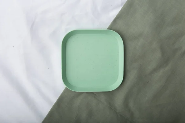 top of view a green plastic plate