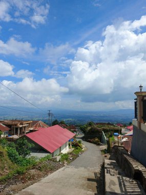 village road on the hill, Mountain hill path road panoramic landscape in indonesia clipart