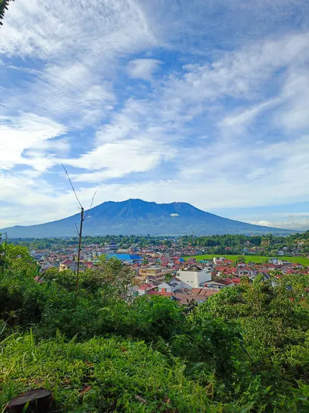 stock image portrait of the view from the top of the hill of a beautiful housing complex under the foot of the mountain