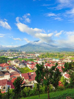 The photo of clouds and Mount Singgalang was taken from the top of the hill and shows a view of the city below clipart