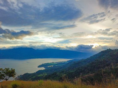 Beautiful view of Lake Singkarak from the top of Aua Sarumpun, West Sumatra clipart