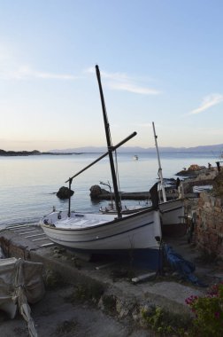 Two boats moored on the beach