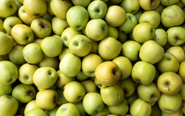 Bulk golden apples for sale in the market