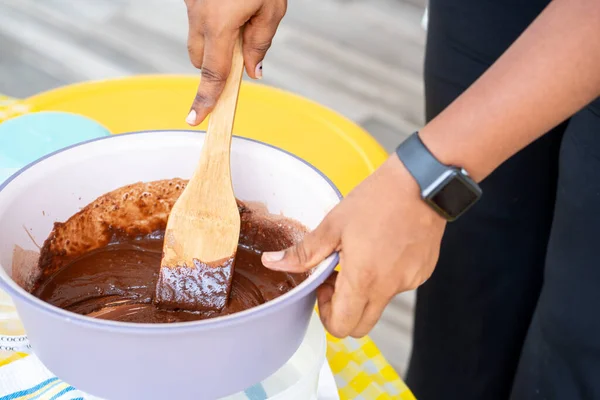 Closeup Hands Pouring Pudding Chocolate Cream White Plate — Stock Photo, Image