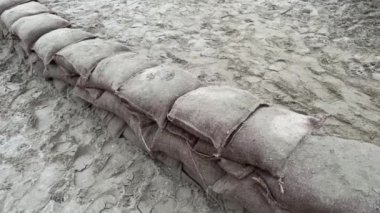 Sandbags to protect the sand
