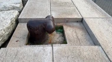 The rusty metal mooring rope for large ships