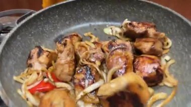 Meat and onion mixed in the pan while frying them in slow motion