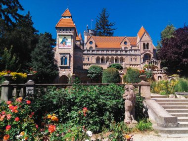 A fabulous building and its flower garden