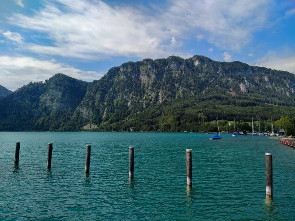 There is a beautiful blue lake next to the mountain